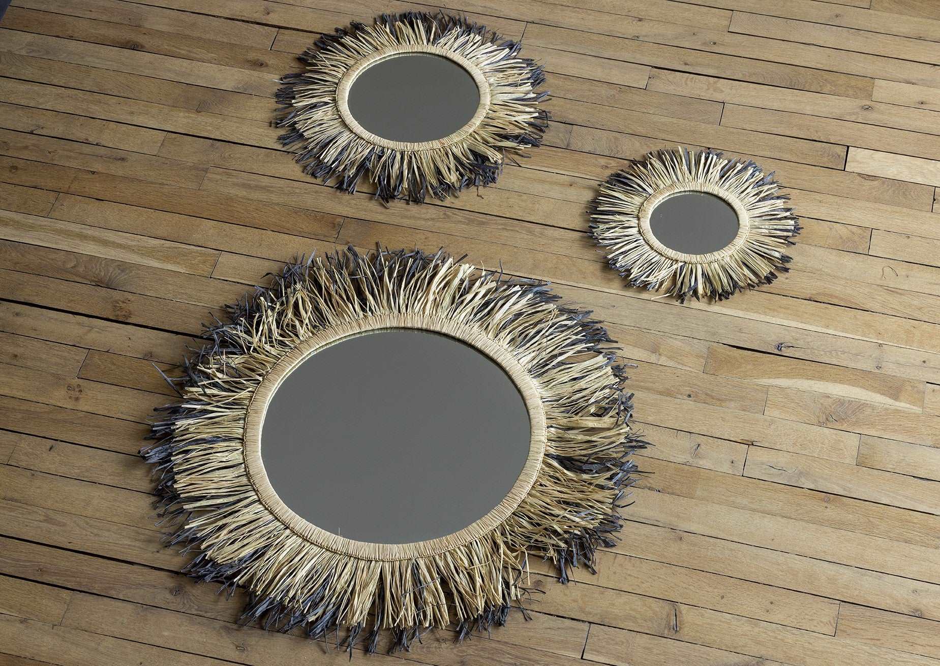 Grand miroir rond à franges de raphia