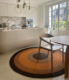 Tapis en raphia rond orange, brun et noir, fait main, dimensions 200 cm, idéal pour une décoration intérieure chaleureuse.