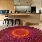 Tapis en raphia rond orange, rose fuchsia et violet, 200 cm.