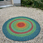 Tapis en raphia rond multicolore vert, bleu, turquoise, orange et rouge, fait main, 180 cm.